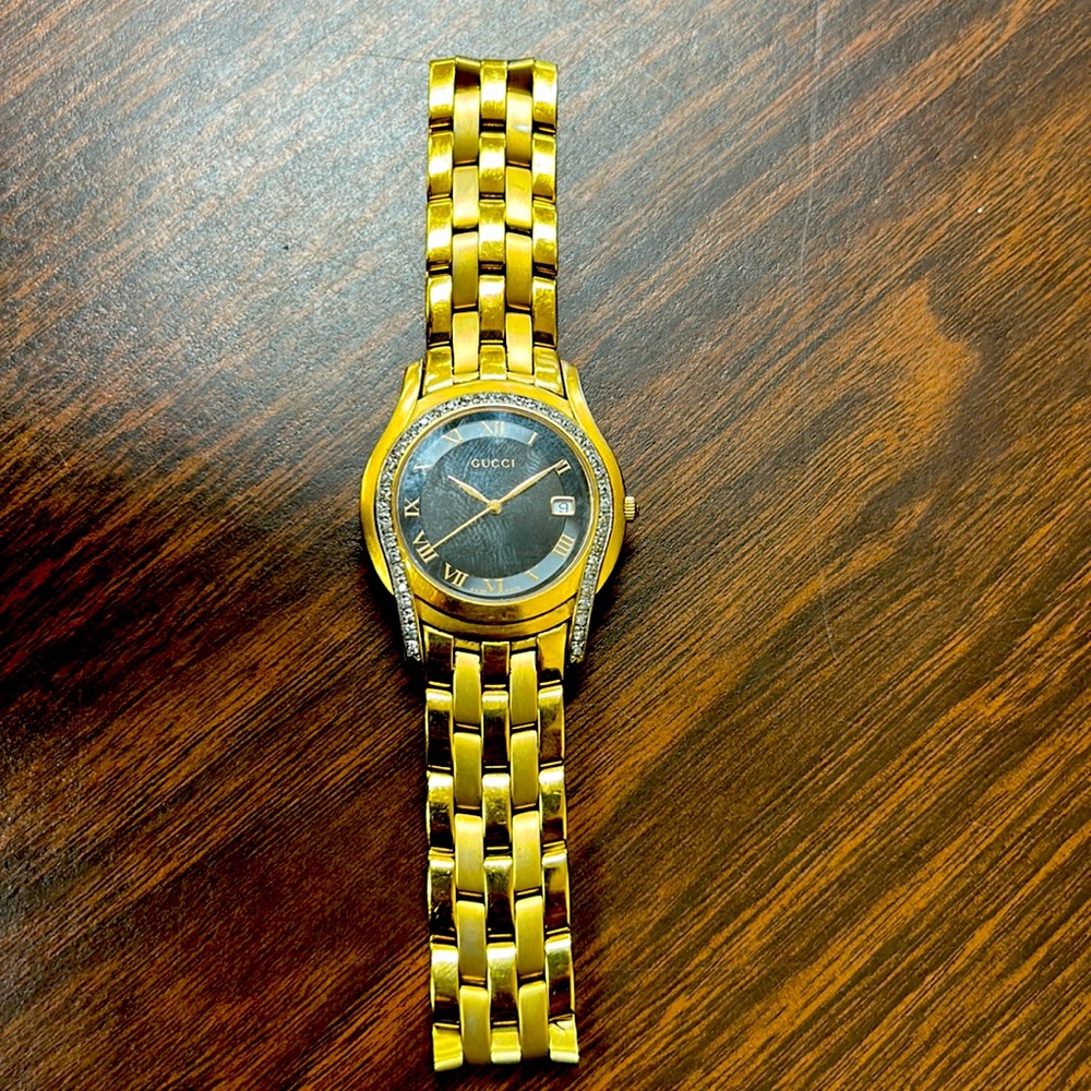 Men’s Gucci watch with diamonds